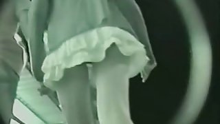 A night video of a girl in white skirt walking with her boy