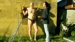 Filthy Slut Tied Poor Guy And Jerks His Cock Outdoors