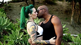 Tattooed white chick is fucked anally by big black fellow