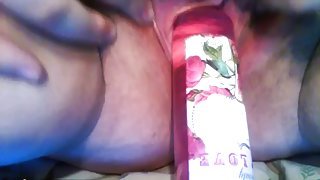 Bottle insertion done well by a huge BBW slut