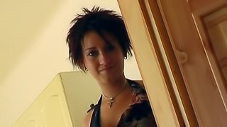 A cute girl with short hair jerks a guy off and makes him cum