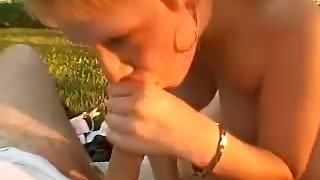 Horny and sweet blondie in the garden giving amazing blowjob