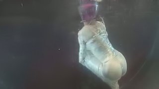 Cherry Torn the girl with pink hair in water bondage vid