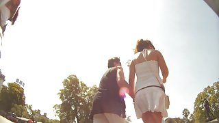 Pretty girl in white summer dress is filmed on a spy cam
