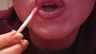 Watch amateur bitch putting on some lipstick on her sexy lips