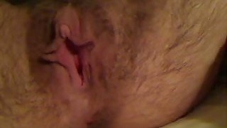 Fucking hairy bitch plays with her snatch in front of a camera