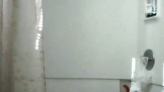 Magnificent tanned beauty soaps up her big booty in shower