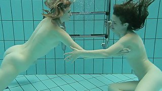Two cute white sexy college girls from Russia under water