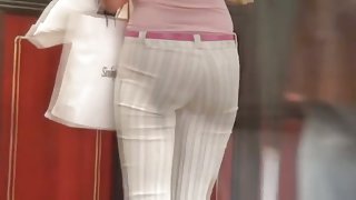 A seductive chick filmed in a voyeur street candid video