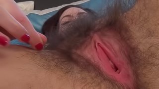 Tattooed milf Sharlyn fucks in her hairy snatch