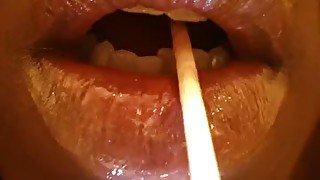 Check out juicy glossed soft lips sucking a lollipop