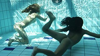 Two fresh European sexy teenies underwater showing bodies