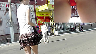 Public upskirt view presents charming red panties