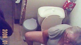 Horny granny gets caught on tape by me when peeing in the toilet room