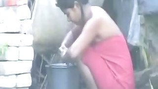 Indian neighbor girl washes outdoors as I film her on spy cam